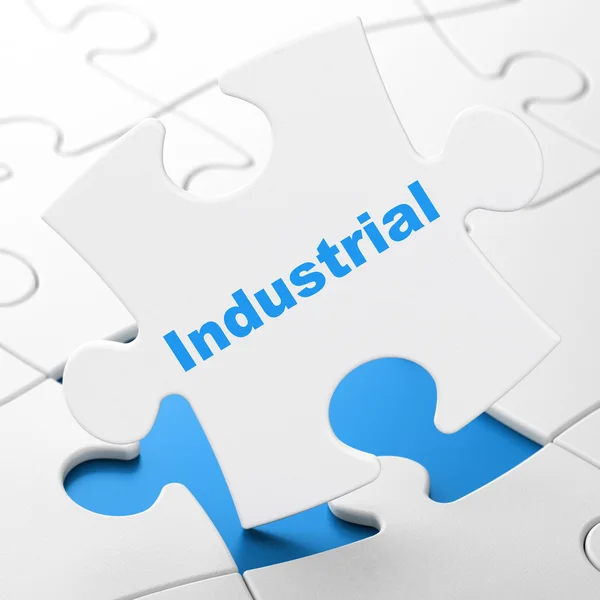 Manufacuring concept: Industrial on puzzle background — Stock Photo, Image