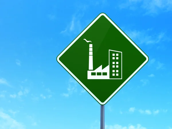 Manufacuring concept: Industry Building on road sign background — Stock fotografie