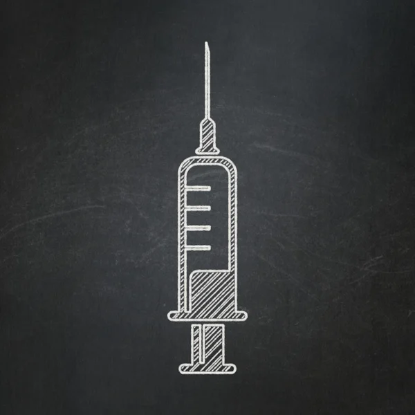 Healthcare concept: Syringe on chalkboard background — Stok fotoğraf