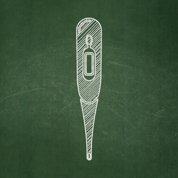 Medicine concept: Thermometer on chalkboard background — 图库照片