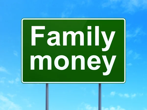 Concepto de dinero: Dinero familiar en el fondo de la señal de tráfico —  Fotos de Stock