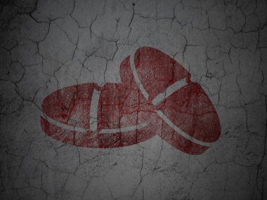 Medicine concept: Pills on grunge wall background