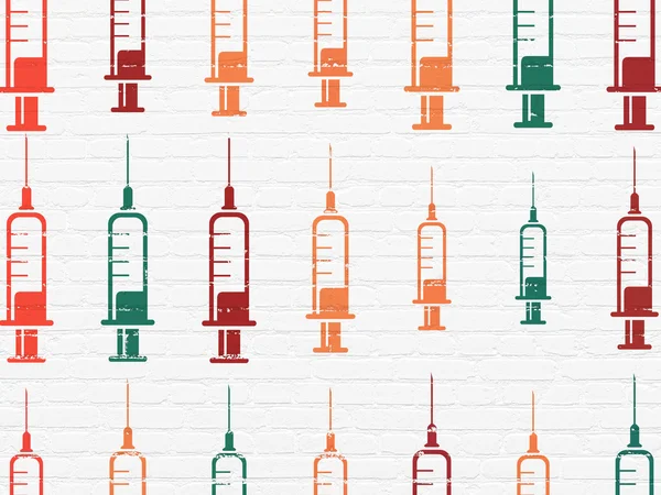Концепция здоровья: иконки шприца на фоне стен — стоковое фото