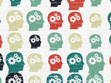 Data concept: Head With Gears icons on wall background