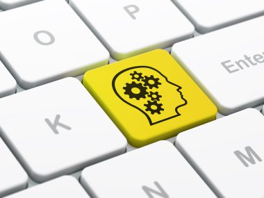 Information concept: Head With Gears on computer keyboard background
