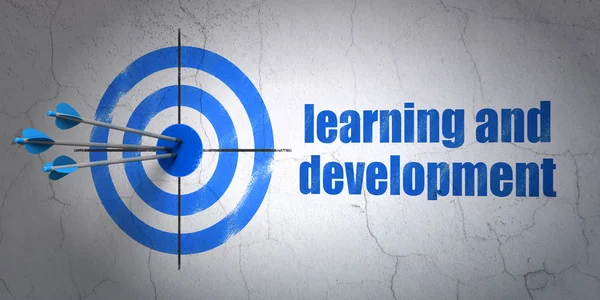 Studying concept: target and Learning And Development on wall background — 图库照片