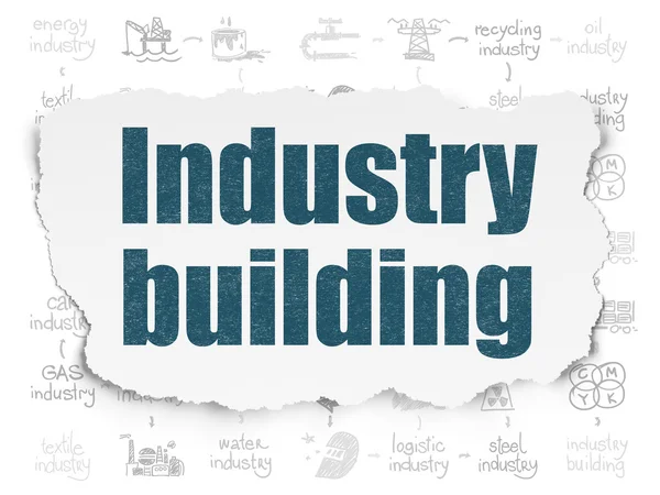Branchenkonzept: Industrie baut auf zerrissenem Papierhintergrund — Stockfoto