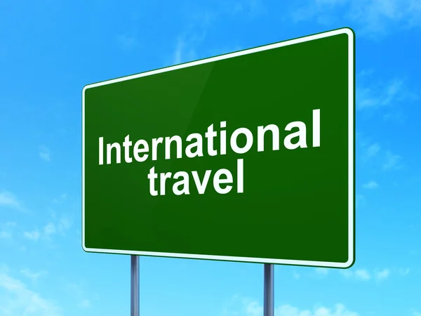 Vacation concept: International Travel on road sign background — Zdjęcie stockowe