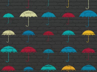 Privacy concept: Umbrella icons on wall background