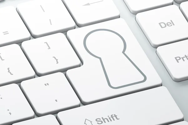 Концепция безопасности: Замочная скважина на фоне клавиатуры компьютера — стоковое фото