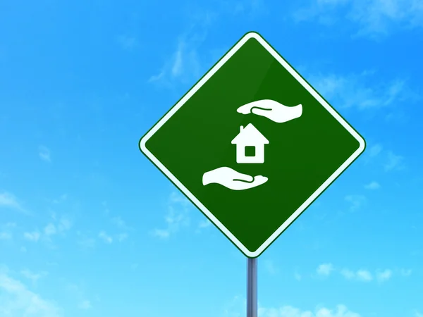 Insurance concept: House And Palm on road sign background — Stock fotografie