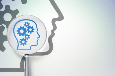 reklam kavramı: gears ile dijital arka plan üzerinde optik cam ile baş