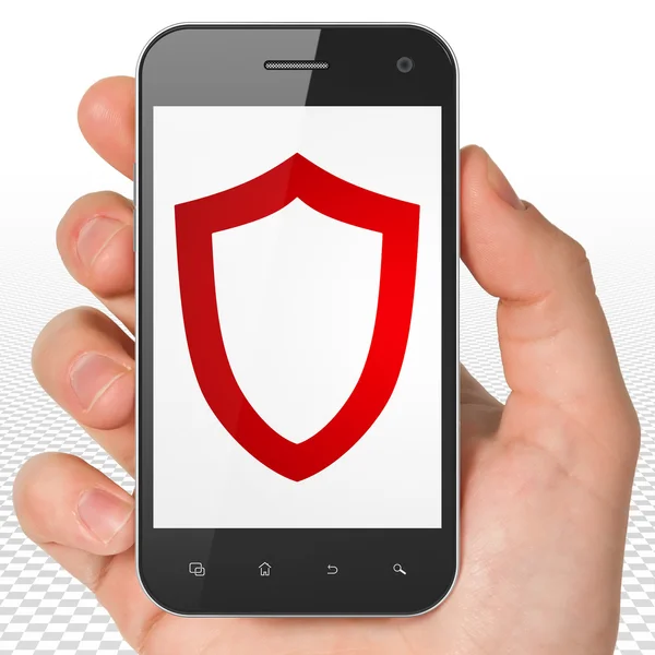 Safety concept: Hand Holding Smartphone with Contoured Shield on display — Stock Photo, Image