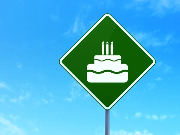 Holiday concept: Cake on road sign background — Stok fotoğraf