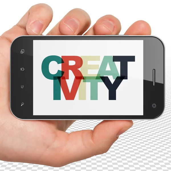 Conceito de publicidade: mão segurando Smartphone com criatividade em exibição — Fotografia de Stock