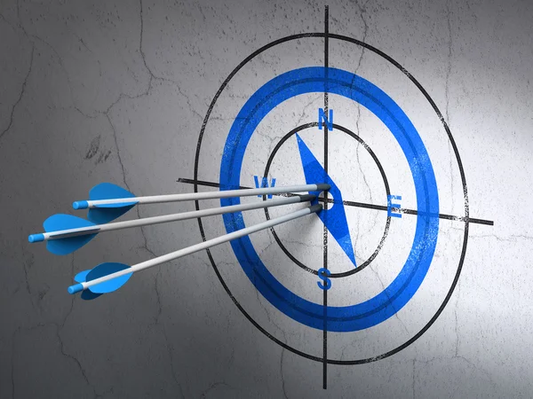 Vacation concept: arrows in Compass target on wall background — Stockfoto