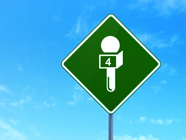 News concept: Microphone on road sign background — Stock Photo, Image