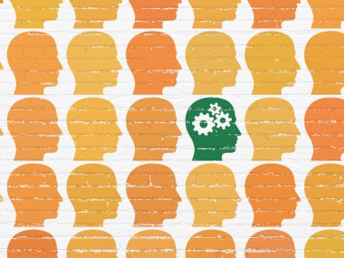 Business concept: head with gears icon on wall background