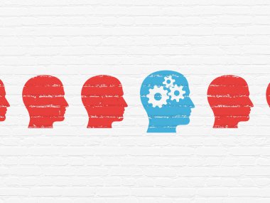 Learning concept: head with gears icon on wall background