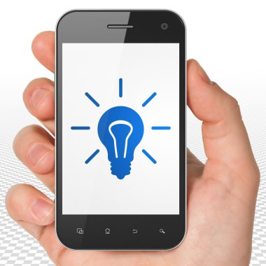 Business concept: Hand Holding Smartphone with Light Bulb on display