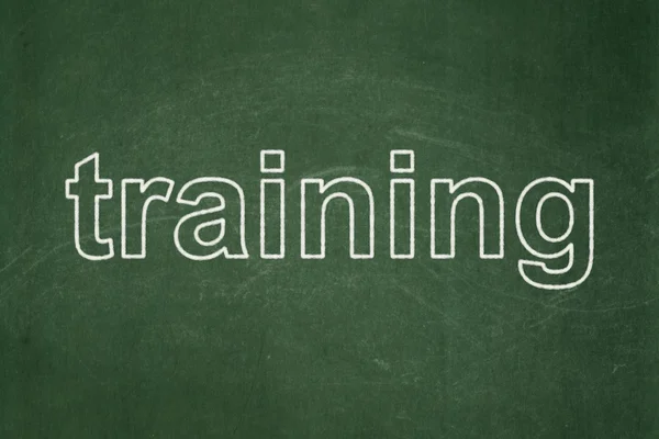 Learning concept: Training on chalkboard background — Stock Photo, Image