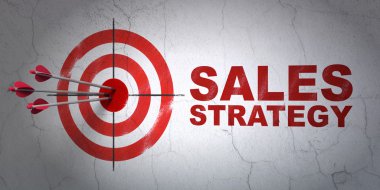 Advertising concept: target and Sales Strategy on wall background