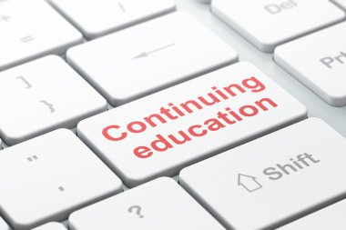 Studying concept: Continuing Education on computer keyboard background