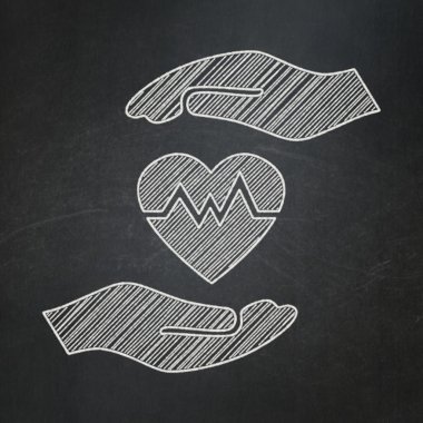 Insurance concept: Heart And Palm on chalkboard background