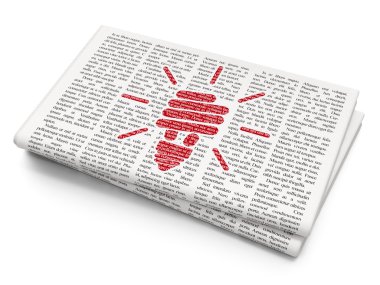 Finance concept: Energy Saving Lamp on Newspaper background
