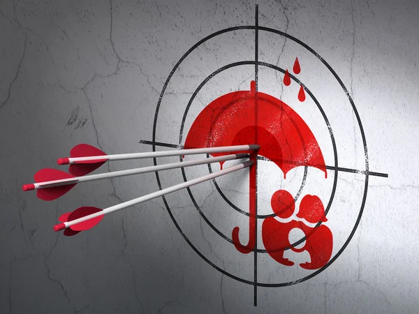 Security concept: arrows in Family And Umbrella target on wall background — Stok fotoğraf