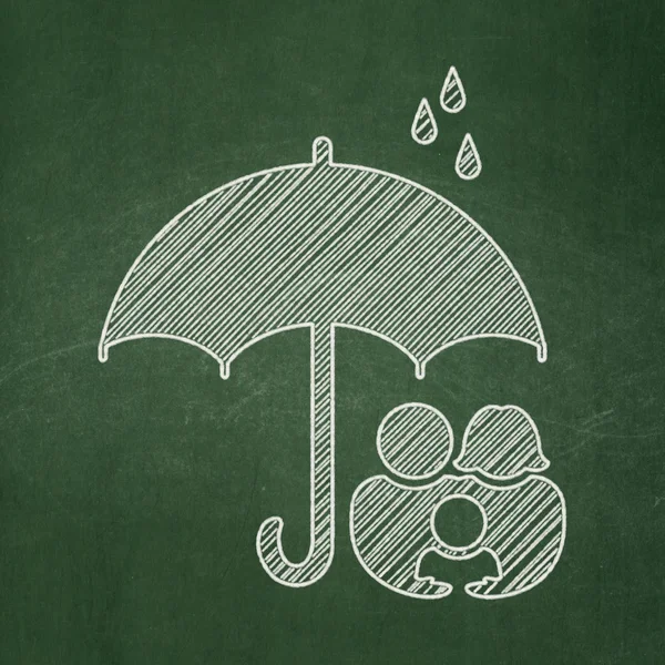 Security concept: Family And Umbrella on chalkboard background — Stok fotoğraf