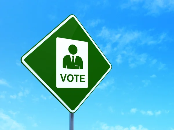 Концепція політики: голосування на фоні дорожнього знаку — стокове фото