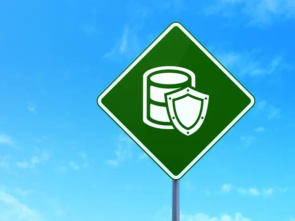 Software concept: Database With Shield on road sign background — Stockfoto