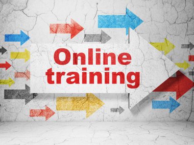 Studying concept: arrow with Online Training on grunge wall background