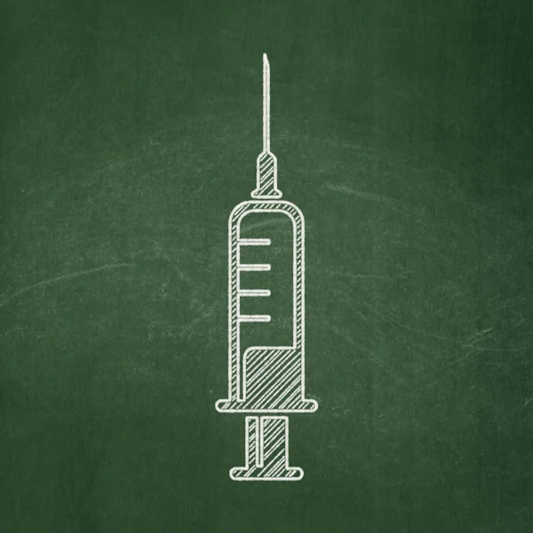 Health concept: Syringe on chalkboard background — ストック写真