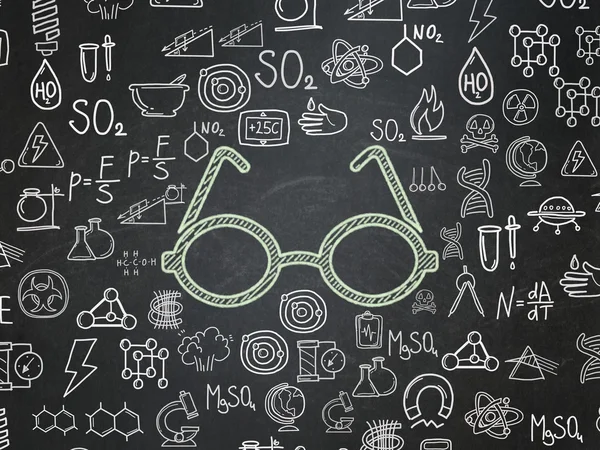 Наукова концепція: окуляри на фоні шкільної дошки — стокове фото
