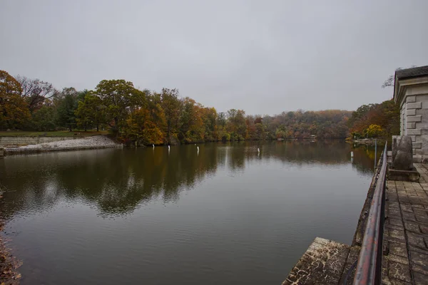 Lake view with autumn trees at Lake Roland Park Baltimore Maryland USA