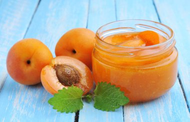 Fresh apricots with green mint ,jam in glass jar
