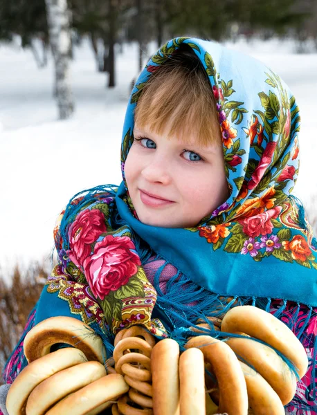 Holiday. Beautiful girl in scarf on wintery background — Stock Photo, Image