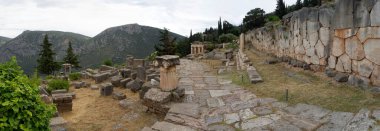 Panoramic view of the Syracuse Treasury Site the with columns and stoa of Athenians in Delphi in Greece 