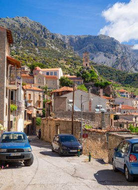 The symbol of the tourist city is the Arachova clock Tower on a mountain in Greece on a sunny day