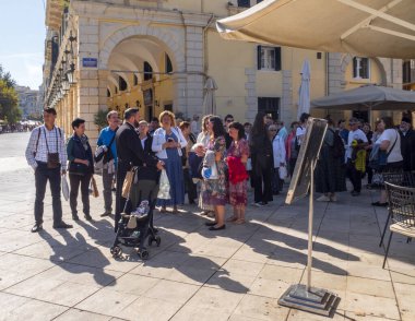Kerkyra, Corfu, Greece. October 30, 2024: Tourists on Liston Eleftheria Pedestrian Street of the Old Town of Kerkyra on the island of Corfu in Greece