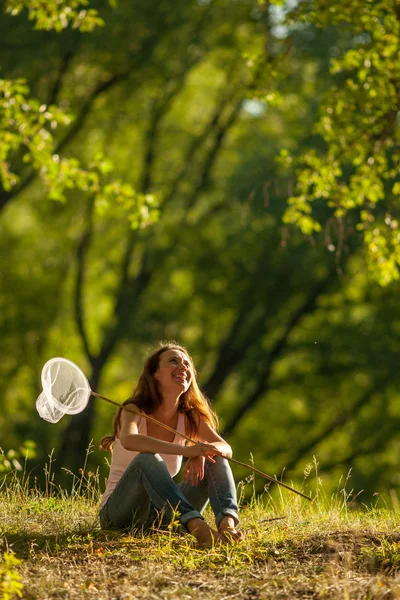 Girl with butterfly net — Stock Photo, Image
