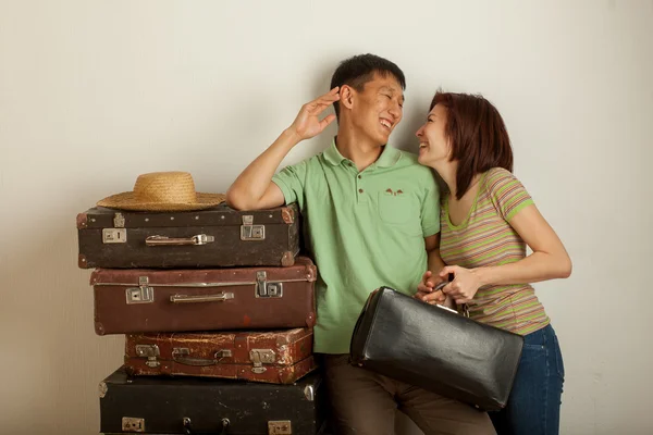 Couple in suitcases — Stock Photo, Image