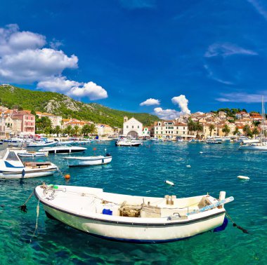 Turquoise waterfront of town Hvar clipart