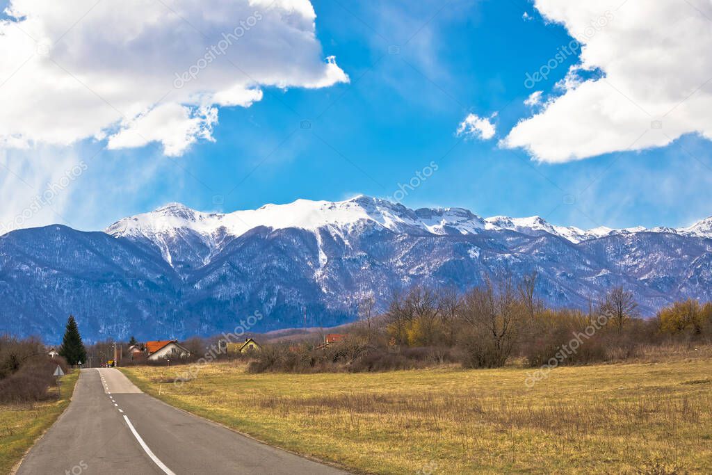 Lika road landscape and Velebit mountain snowy peaks view, Lika region of Croatia