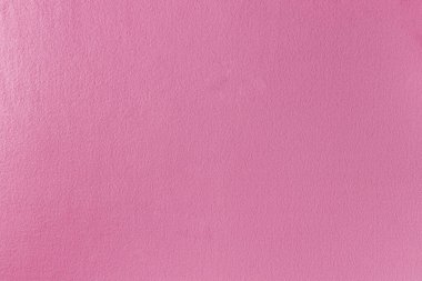 Yığınla yalanı olan pembe kumaştan yapılmış rahat bir ekose. Yumuşak örtülü yumuşak örtü dokusu.