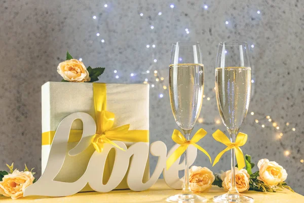 Two Champagne Glasses Yellow Bows Standing Table Love Letters Gift — Stock Photo, Image