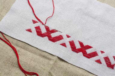 Ukrainian national red embroidery thread, selective focus