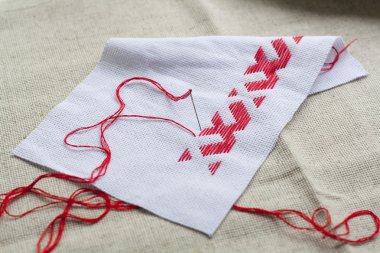 Ukrainian national red embroidery thread, selective focus